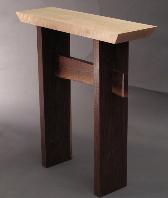 Our statement side table with a live edge table stretcher brings nature to your interior decor.  This narrow wood table is the perfect small entryway console, narrow hall table or artistic side table for your contemporary furniture collection.